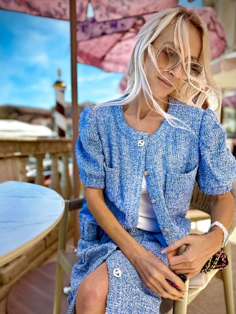 Lee Davies — editorial portrait · Chanel tweed · café terrace
